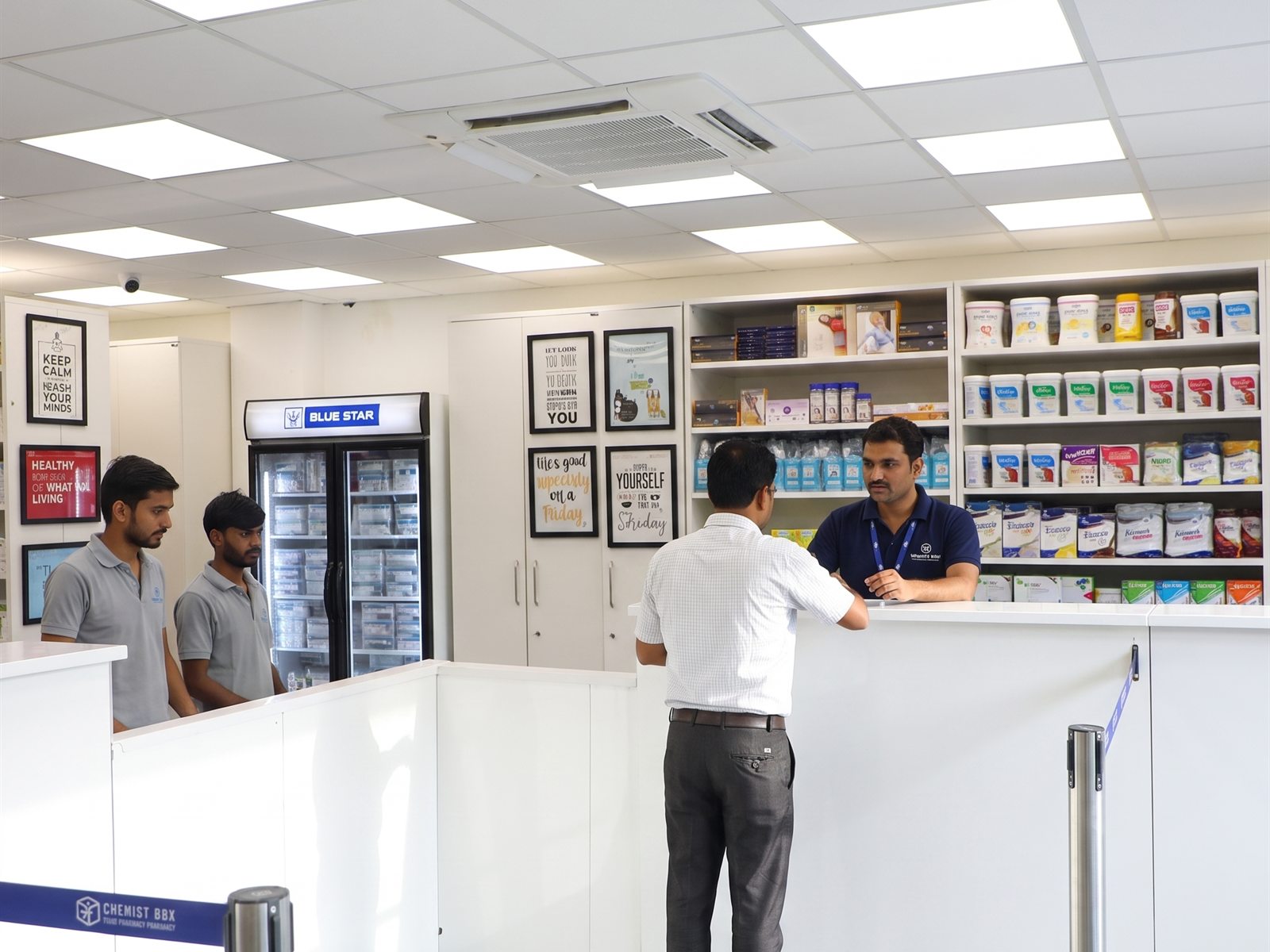 Customers queuing at the Chemist Box billing counter, rated 4.5+ on Google